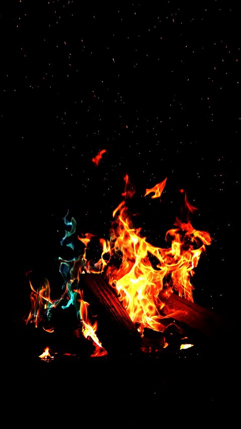 Download wallpaper 2160x3840 bonfire, fire, firewood, sparks, dark, light, camping samsung galaxy s4, s5, note, sony xperia z, z1, z2, z3, htc one, lenovo vibe hd background