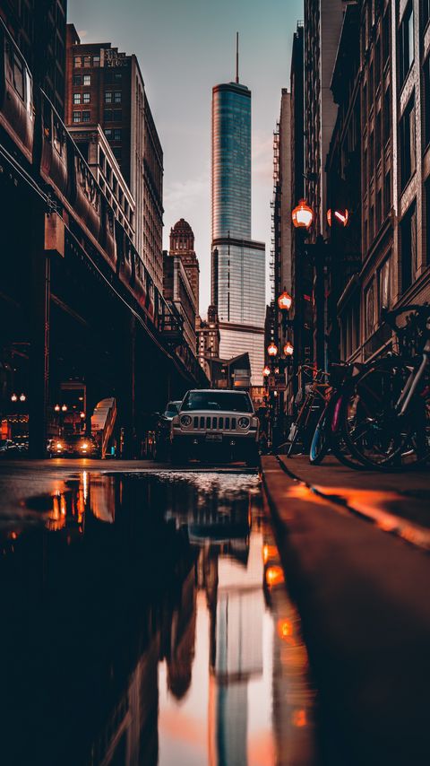 Download wallpaper 2160x3840 street, city, reflection, puddle, cars, buildings, bicycles samsung galaxy s4, s5, note, sony xperia z, z1, z2, z3, htc one, lenovo vibe hd background