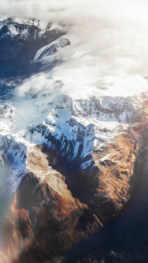 Download wallpaper 2160x3840 mountains, aerial view, tops, snow, clouds samsung galaxy s4, s5, note, sony xperia z, z1, z2, z3, htc one, lenovo vibe hd background