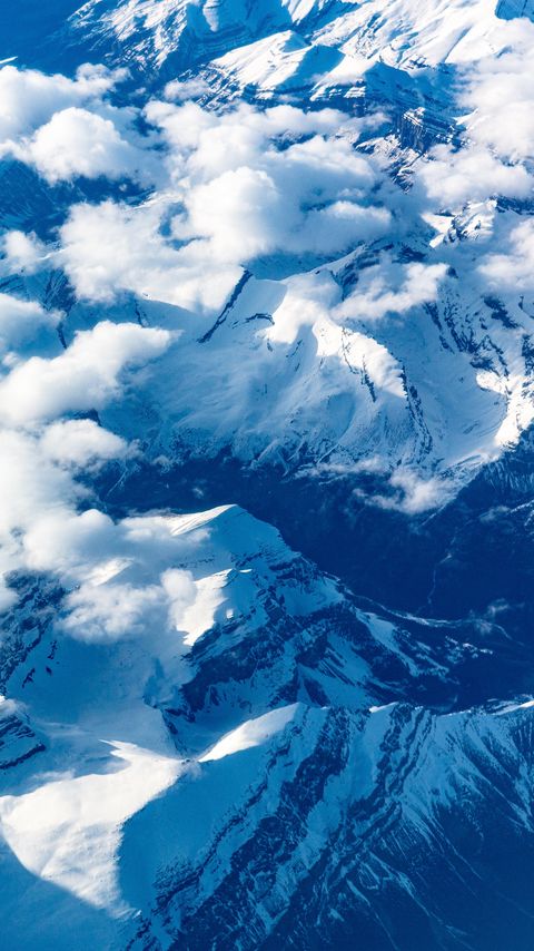 Download wallpaper 2160x3840 mountains, clouds, aerial view, peaks, snowy samsung galaxy s4, s5, note, sony xperia z, z1, z2, z3, htc one, lenovo vibe hd background