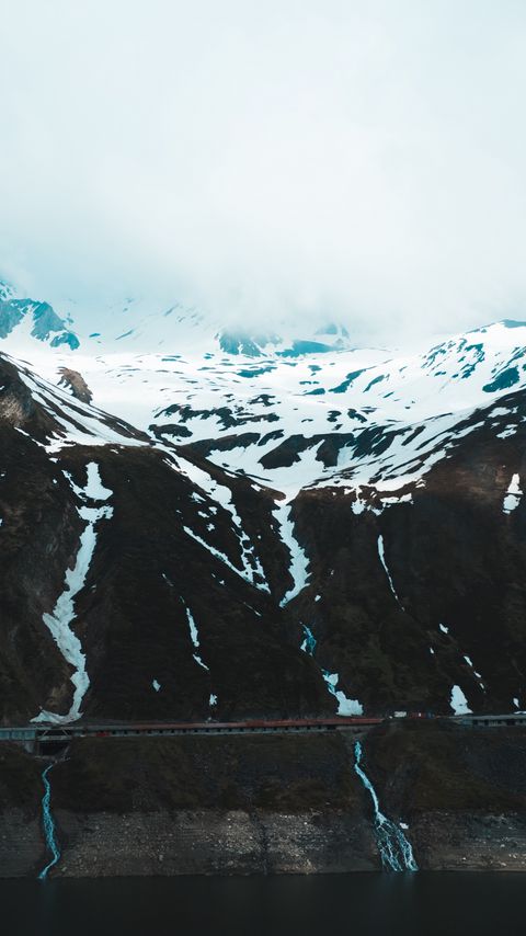 Download wallpaper 2160x3840 mountains, snow, clouds, slope, cliff samsung galaxy s4, s5, note, sony xperia z, z1, z2, z3, htc one, lenovo vibe hd background