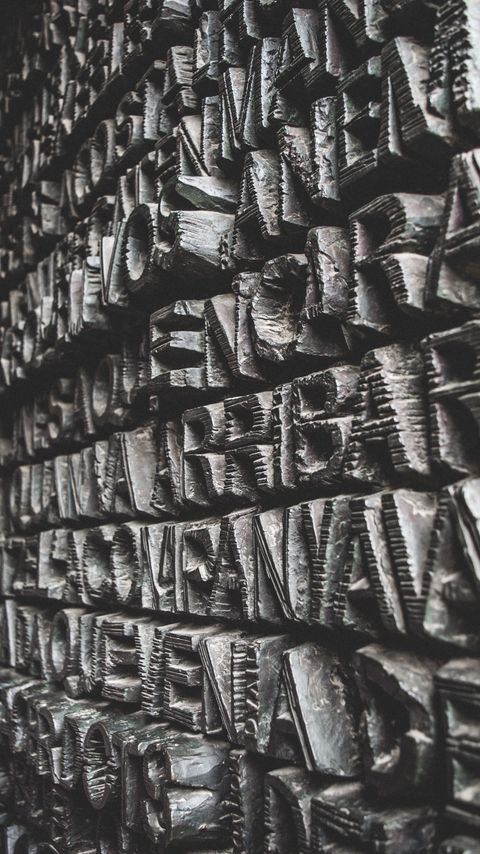 Download wallpaper 2160x3840 letters, wall, relief, stone, texture samsung galaxy s4, s5, note, sony xperia z, z1, z2, z3, htc one, lenovo vibe hd background