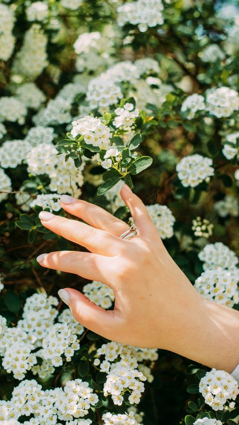 Download wallpaper 2160x3840 hand, ring, flowers, bloom samsung galaxy s4, s5, note, sony xperia z, z1, z2, z3, htc one, lenovo vibe hd background