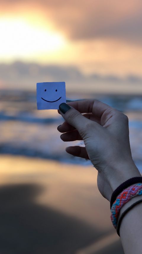 Download wallpaper 2160x3840 smile, smiley, hand, paper, positive samsung galaxy s4, s5, note, sony xperia z, z1, z2, z3, htc one, lenovo vibe hd background