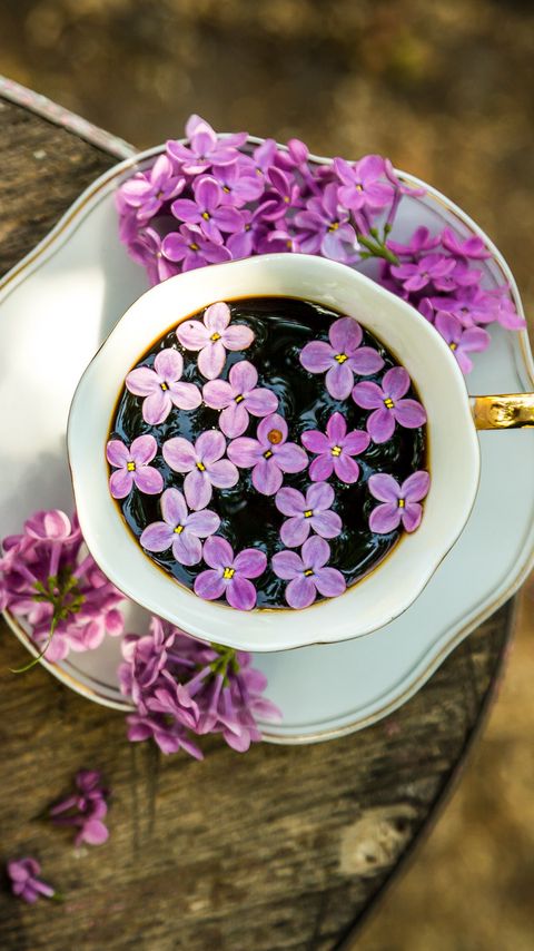 Download wallpaper 2160x3840 coffee, cup, lilac, flowers, wooden samsung galaxy s4, s5, note, sony xperia z, z1, z2, z3, htc one, lenovo vibe hd background