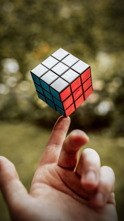 Download wallpaper 2160x3840 rubiks cube, hand, fingers, touch samsung galaxy s4, s5, note, sony xperia z, z1, z2, z3, htc one, lenovo vibe hd background