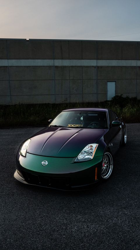 Download wallpaper 2160x3840 nissan, car, sports car, front view, headlights, building samsung galaxy s4, s5, note, sony xperia z, z1, z2, z3, htc one, lenovo vibe hd background