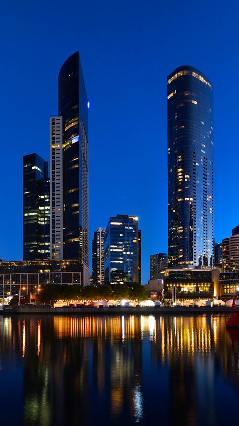 Download wallpaper 2160x3840 skyscrapers, architecture, reflection, lights, night samsung galaxy s4, s5, note, sony xperia z, z1, z2, z3, htc one, lenovo vibe hd background