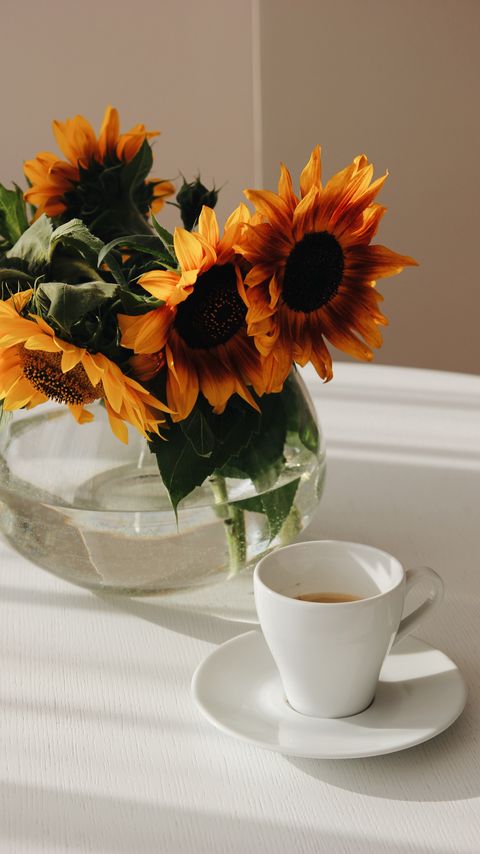 Download wallpaper 2160x3840 sunflowers, bouquet, cup, vase, table samsung galaxy s4, s5, note, sony xperia z, z1, z2, z3, htc one, lenovo vibe hd background