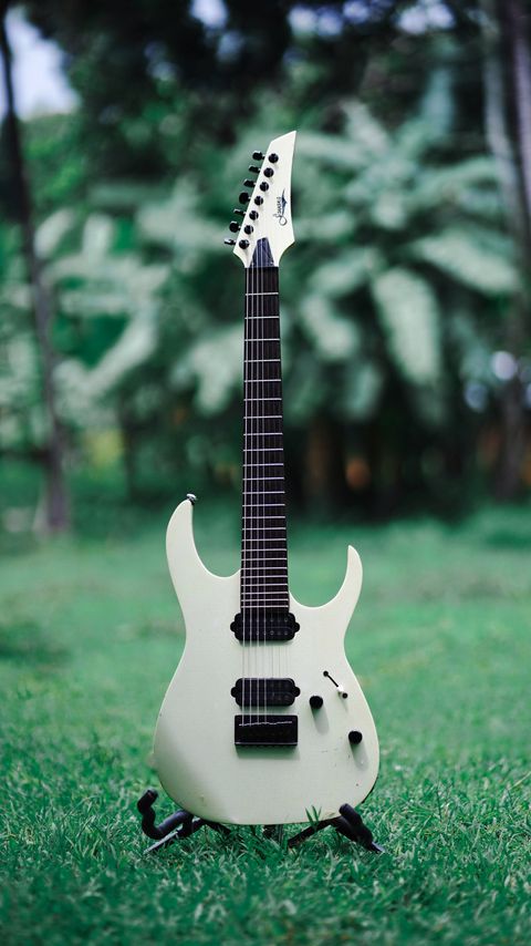 Download wallpaper 2160x3840 electric guitar, guitar, musical instrument, white, grasses samsung galaxy s4, s5, note, sony xperia z, z1, z2, z3, htc one, lenovo vibe hd background