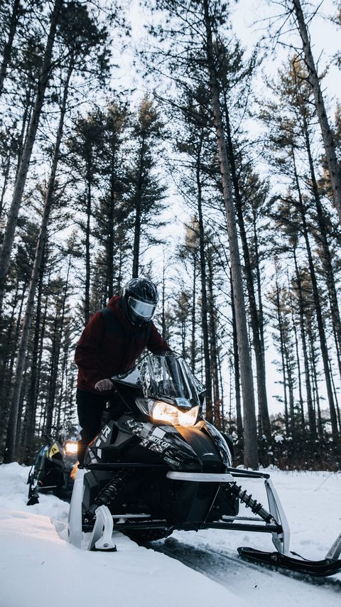 Download wallpaper 2160x3840 snowmobile, snow, winter, man, forest, nature samsung galaxy s4, s5, note, sony xperia z, z1, z2, z3, htc one, lenovo vibe hd background