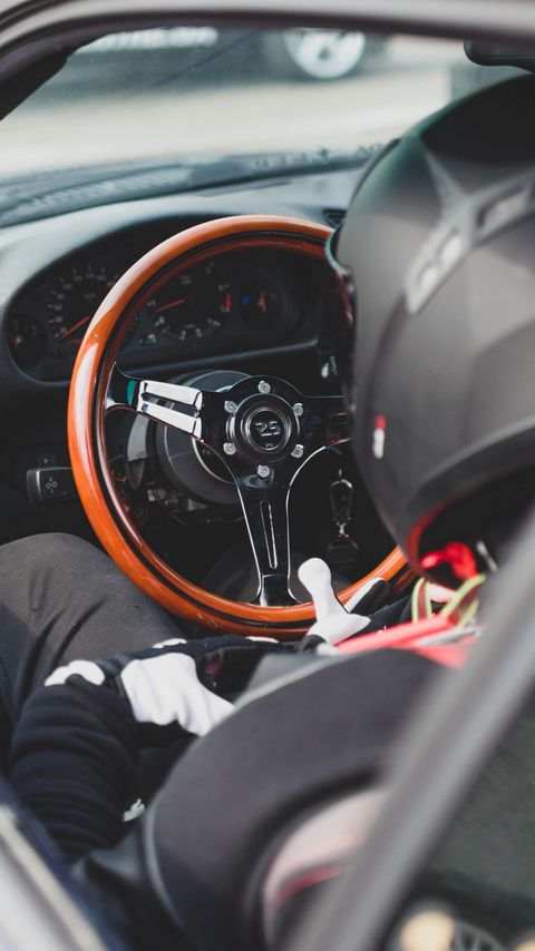 Download wallpaper 2160x3840 car, steering wheel, racer, helmet, salon samsung galaxy s4, s5, note, sony xperia z, z1, z2, z3, htc one, lenovo vibe hd background