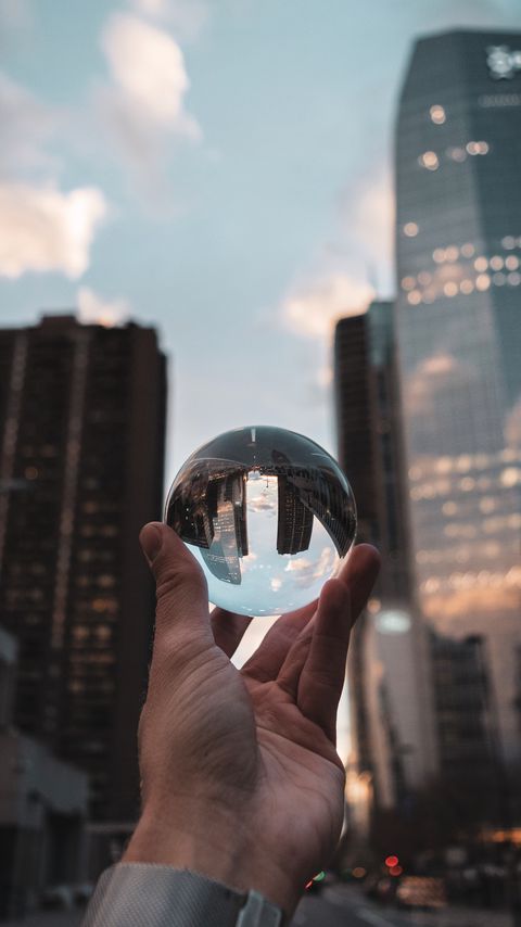 Download wallpaper 2160x3840 crystal ball, ball, hand, reflection, city, buildings samsung galaxy s4, s5, note, sony xperia z, z1, z2, z3, htc one, lenovo vibe hd background