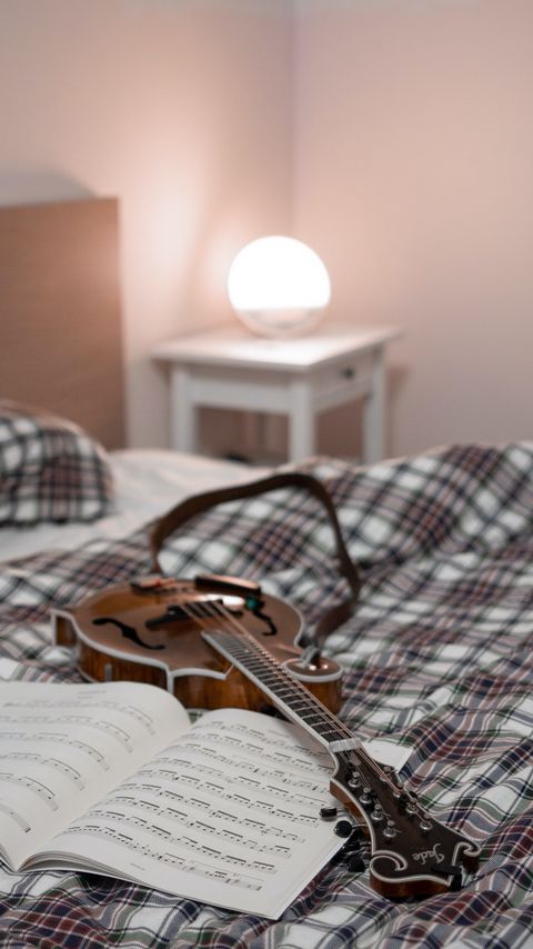 Download wallpaper 2160x3840 electric guitar, guitar, sheet music, lamp, bed, music samsung galaxy s4, s5, note, sony xperia z, z1, z2, z3, htc one, lenovo vibe hd background