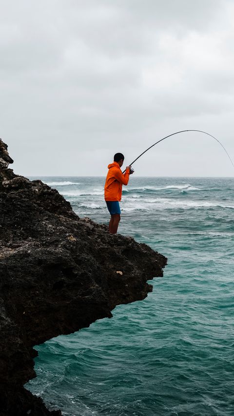 Download wallpaper 2160x3840 fishing, fisherman, boy, fishing rod, rock, sea samsung galaxy s4, s5, note, sony xperia z, z1, z2, z3, htc one, lenovo vibe hd background