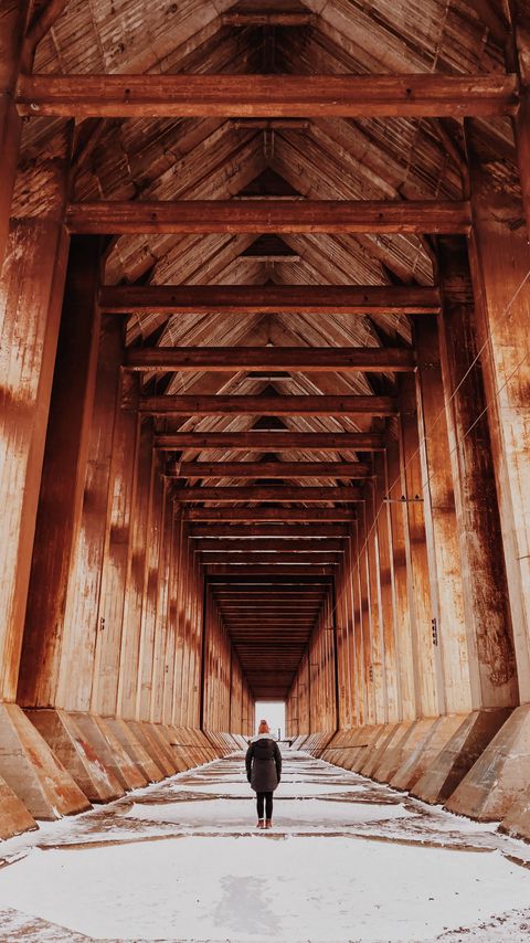 Download wallpaper 2160x3840 girl, alone, building, tunnel, columns, snow, winter samsung galaxy s4, s5, note, sony xperia z, z1, z2, z3, htc one, lenovo vibe hd background