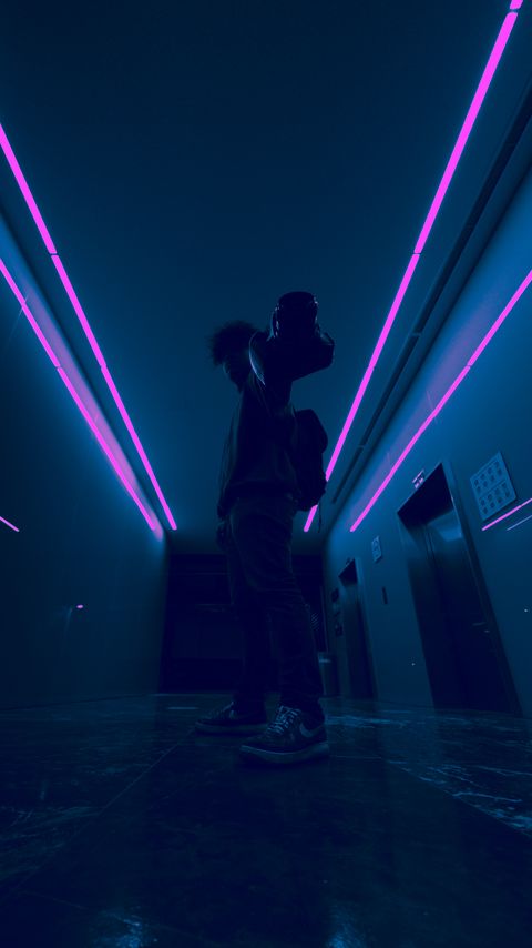 Download wallpaper 2160x3840 man, camera, neon, corridor, dark samsung galaxy s4, s5, note, sony xperia z, z1, z2, z3, htc one, lenovo vibe hd background