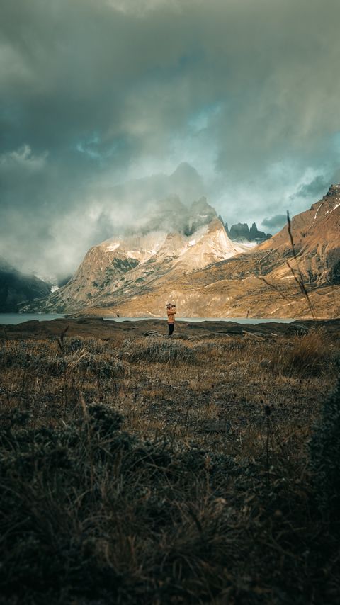 Download wallpaper 2160x3840 man, photographer, mountains, nature samsung galaxy s4, s5, note, sony xperia z, z1, z2, z3, htc one, lenovo vibe hd background