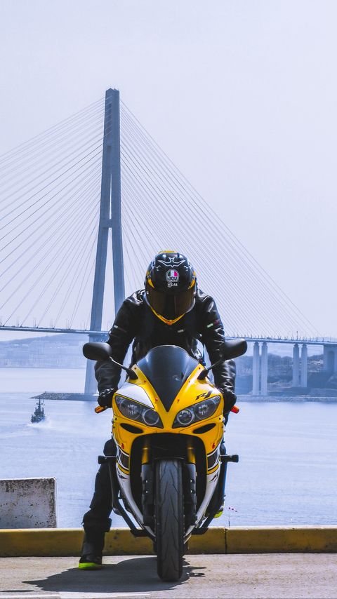 Download wallpaper 2160x3840 motorcycle, yellow, motorcyclist, helmet, bridge samsung galaxy s4, s5, note, sony xperia z, z1, z2, z3, htc one, lenovo vibe hd background