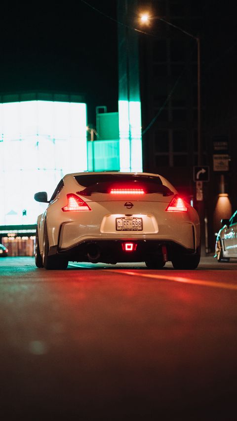 Download wallpaper 2160x3840 nissan 370z, nissan, car, white, road, night samsung galaxy s4, s5, note, sony xperia z, z1, z2, z3, htc one, lenovo vibe hd background