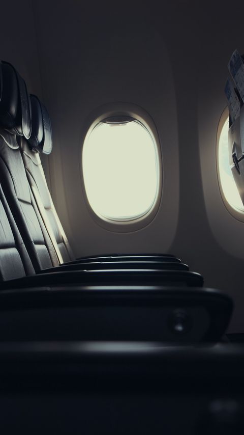 Download wallpaper 2160x3840 plane, seat, porthole, window, light samsung galaxy s4, s5, note, sony xperia z, z1, z2, z3, htc one, lenovo vibe hd background