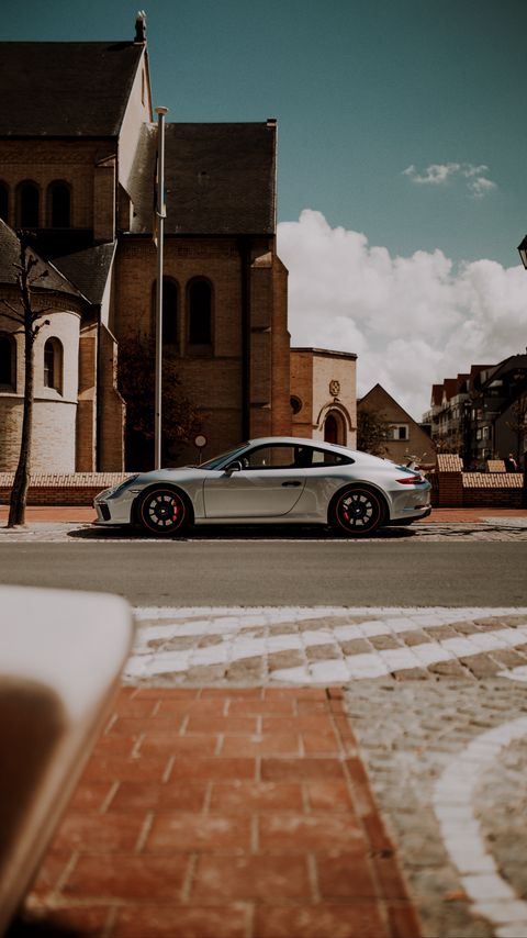 Download wallpaper 2160x3840 porsche, car, silver, road, buildings, architecture samsung galaxy s4, s5, note, sony xperia z, z1, z2, z3, htc one, lenovo vibe hd background