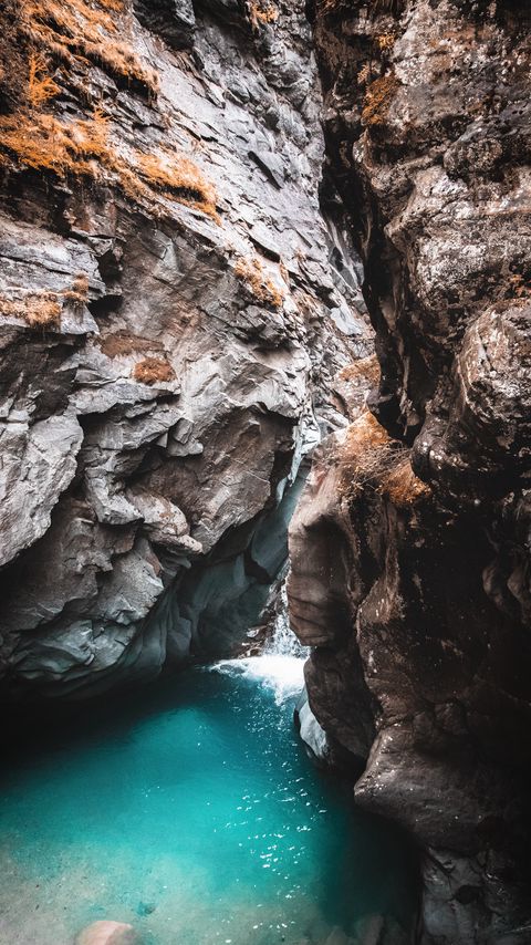 Download wallpaper 2160x3840 rocks, cave, gorge, body of water, water, nature samsung galaxy s4, s5, note, sony xperia z, z1, z2, z3, htc one, lenovo vibe hd background