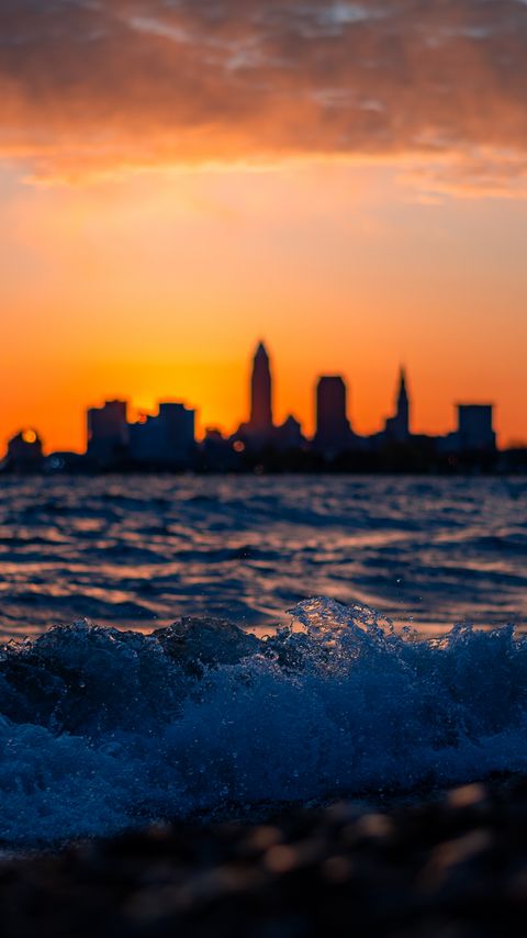 Download wallpaper 2160x3840 sea, waves, city, buildings, silhouettes, sunset samsung galaxy s4, s5, note, sony xperia z, z1, z2, z3, htc one, lenovo vibe hd background