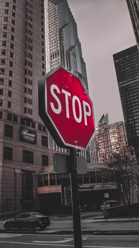 Download wallpaper 2160x3840 stop, sign, word, buildings, city samsung galaxy s4, s5, note, sony xperia z, z1, z2, z3, htc one, lenovo vibe hd background