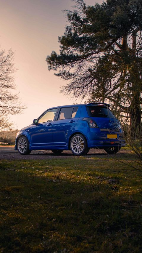 Download wallpaper 2160x3840 suzuki, car, blue, park, trees samsung galaxy s4, s5, note, sony xperia z, z1, z2, z3, htc one, lenovo vibe hd background