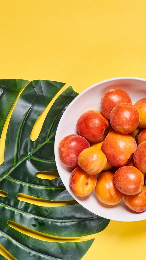 Download wallpaper 2160x3840 apricots, fruit, bowl, fresh, yellow samsung galaxy s4, s5, note, sony xperia z, z1, z2, z3, htc one, lenovo vibe hd background