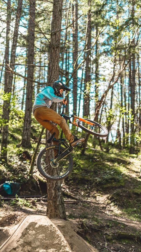 Download wallpaper 2160x3840 bike, cyclist, stunt, forest samsung galaxy s4, s5, note, sony xperia z, z1, z2, z3, htc one, lenovo vibe hd background