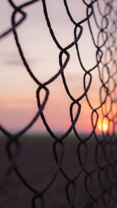 Download wallpaper 2160x3840 fence, mesh, metal, sunset samsung galaxy s4, s5, note, sony xperia z, z1, z2, z3, htc one, lenovo vibe hd background