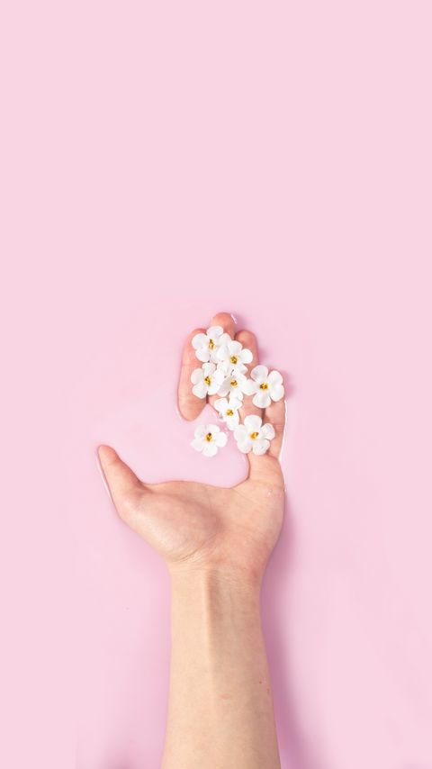 Download wallpaper 2160x3840 hand, flowers, liquid, pink samsung galaxy s4, s5, note, sony xperia z, z1, z2, z3, htc one, lenovo vibe hd background