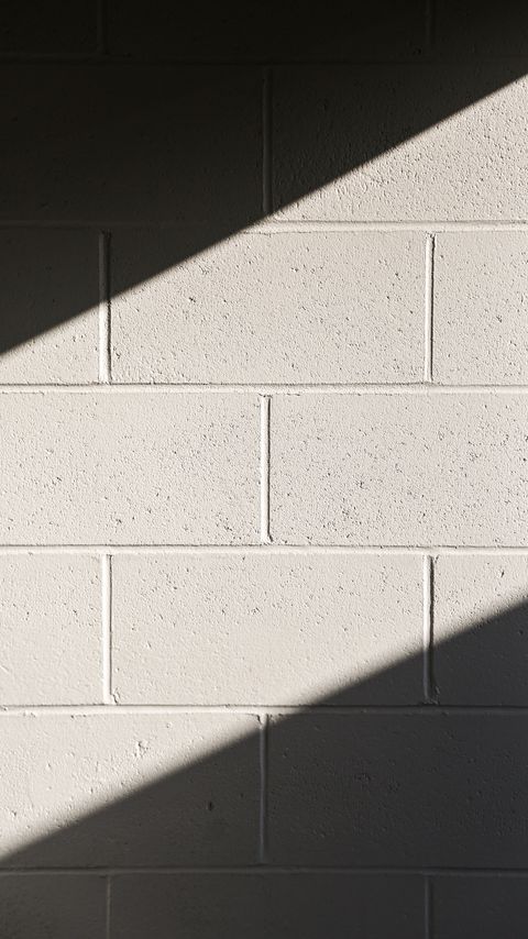 Download wallpaper 2160x3840 wall, brick, shadow, white, texture, background samsung galaxy s4, s5, note, sony xperia z, z1, z2, z3, htc one, lenovo vibe hd background