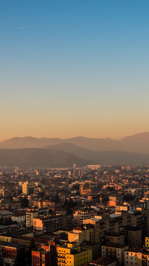 Download wallpaper 2160x3840 city, buildings, roofs, mountains, aerial view samsung galaxy s4, s5, note, sony xperia z, z1, z2, z3, htc one, lenovo vibe hd background