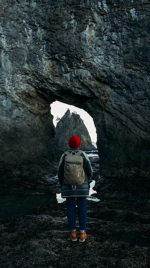 Download wallpaper 2160x3840 man, alone, rocks, arch, nature samsung galaxy s4, s5, note, sony xperia z, z1, z2, z3, htc one, lenovo vibe hd background