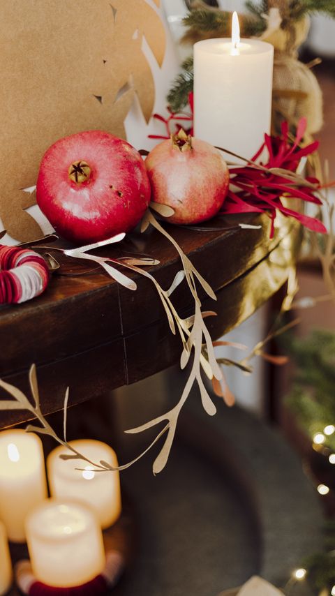 Download wallpaper 2160x3840 pomegranate, fruit, candles, garland, christmas, aesthetics samsung galaxy s4, s5, note, sony xperia z, z1, z2, z3, htc one, lenovo vibe hd background