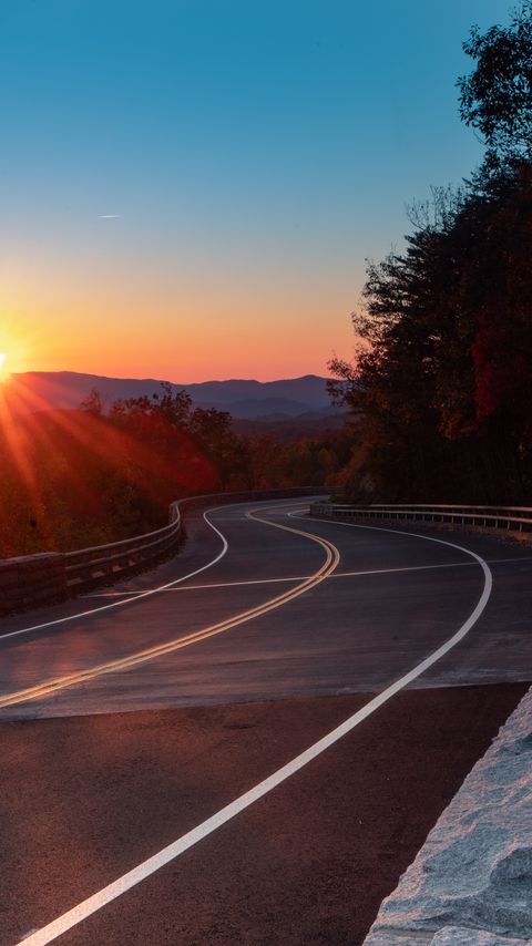 Download wallpaper 2160x3840 road, turn, trees, rays, sunset samsung galaxy s4, s5, note, sony xperia z, z1, z2, z3, htc one, lenovo vibe hd background