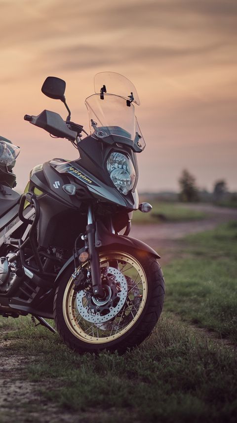 Download wallpaper 2160x3840 suzuki, motorcycle, bike, black, field, sunset, moto samsung galaxy s4, s5, note, sony xperia z, z1, z2, z3, htc one, lenovo vibe hd background