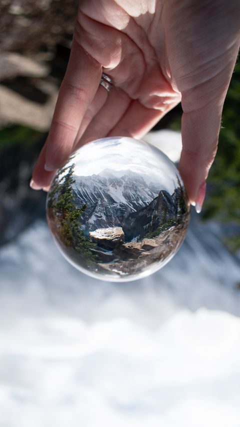Download wallpaper 2160x3840 ball, reflection, mountains, nature, hand samsung galaxy s4, s5, note, sony xperia z, z1, z2, z3, htc one, lenovo vibe hd background