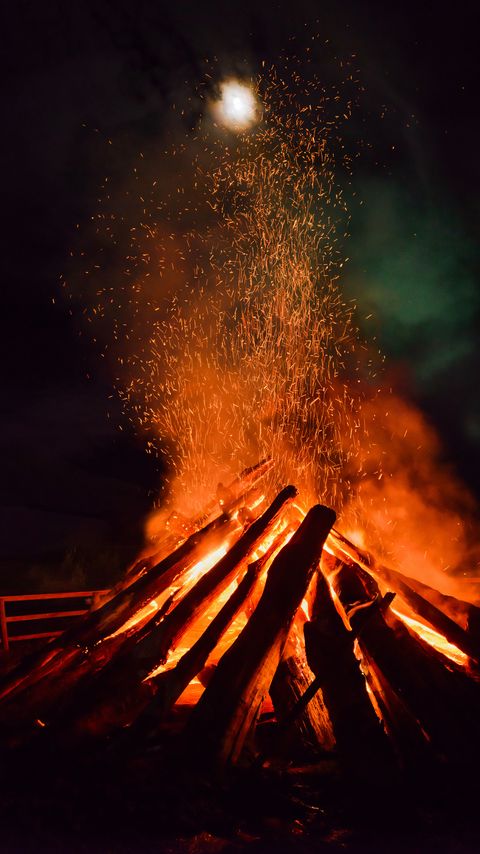 Download wallpaper 2160x3840 bonfire, flame, sparks, logs, night, dark samsung galaxy s4, s5, note, sony xperia z, z1, z2, z3, htc one, lenovo vibe hd background