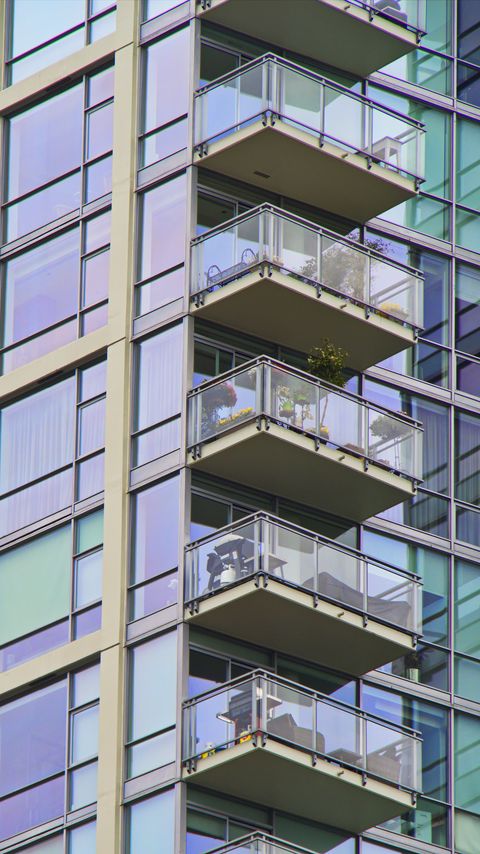 Download wallpaper 2160x3840 building, windows, balconies, flowers, plants samsung galaxy s4, s5, note, sony xperia z, z1, z2, z3, htc one, lenovo vibe hd background