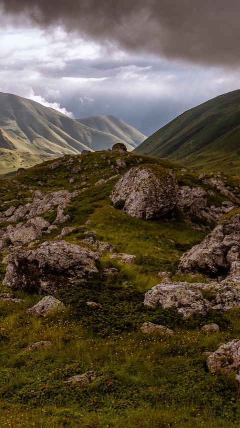 Download wallpaper 2160x3840 hills, valley, clouds, stones, grass samsung galaxy s4, s5, note, sony xperia z, z1, z2, z3, htc one, lenovo vibe hd background