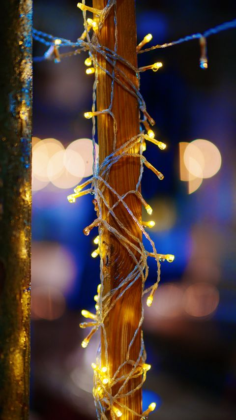 Download wallpaper 2160x3840 pillar, garland, bokeh, glare, holiday samsung galaxy s4, s5, note, sony xperia z, z1, z2, z3, htc one, lenovo vibe hd background