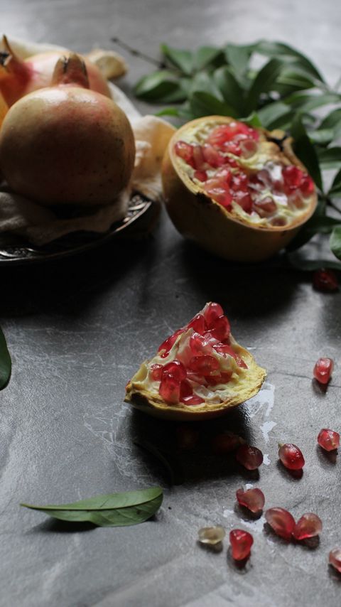 Download wallpaper 2160x3840 pomegranate, fruit, leaf, macro samsung galaxy s4, s5, note, sony xperia z, z1, z2, z3, htc one, lenovo vibe hd background