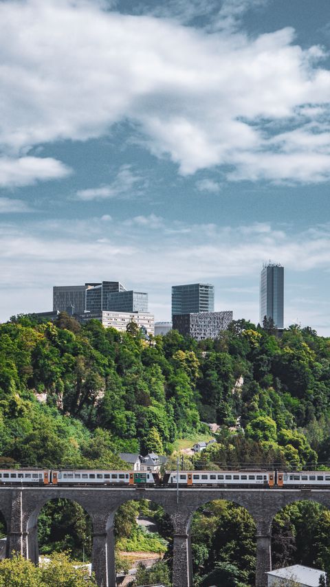 Download wallpaper 2160x3840 railroad, train, buildings, trees, city samsung galaxy s4, s5, note, sony xperia z, z1, z2, z3, htc one, lenovo vibe hd background