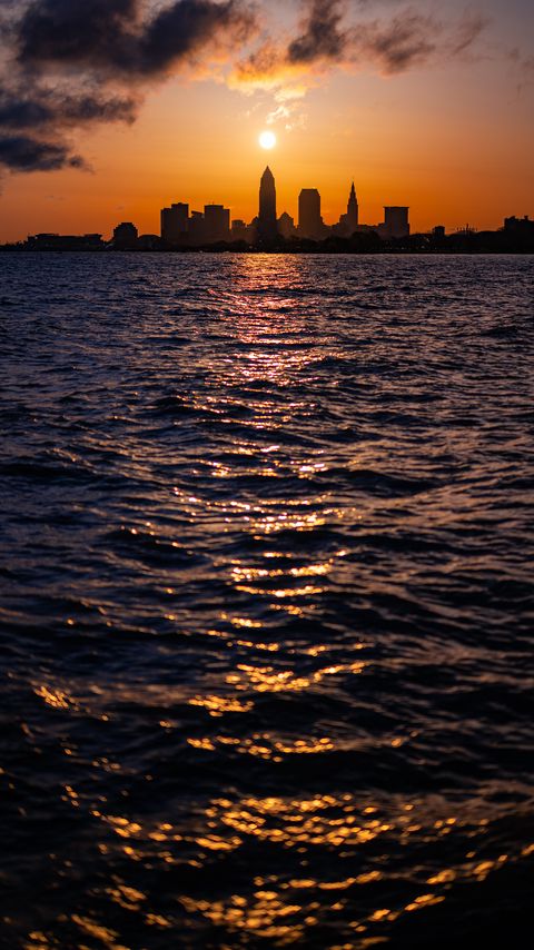 Download wallpaper 2160x3840 sea, waves, city, buildings, sunset samsung galaxy s4, s5, note, sony xperia z, z1, z2, z3, htc one, lenovo vibe hd background