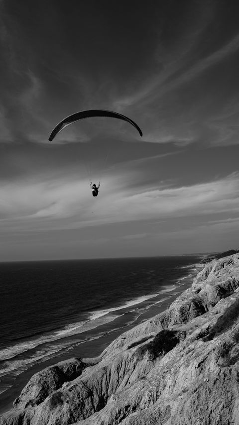 Download wallpaper 2160x3840 skydiver, ocean, coast, black and white samsung galaxy s4, s5, note, sony xperia z, z1, z2, z3, htc one, lenovo vibe hd background