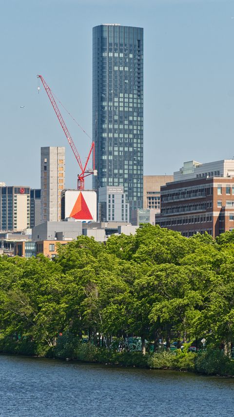 Download wallpaper 2160x3840 skyscraper, construction, trees, city samsung galaxy s4, s5, note, sony xperia z, z1, z2, z3, htc one, lenovo vibe hd background